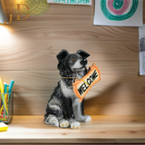 Sitting Dog with Orange Welcome Sign on Wooden