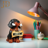 Sitting Dog with Orange Welcome Sign on Wooden