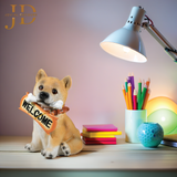 Sitting Dog with Orange Welcome Sign on Wooden