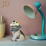 Sitting Dog with Black Welcome Sign
